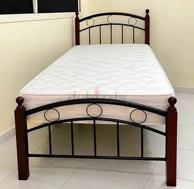 Wood and metal single bed and mattress
