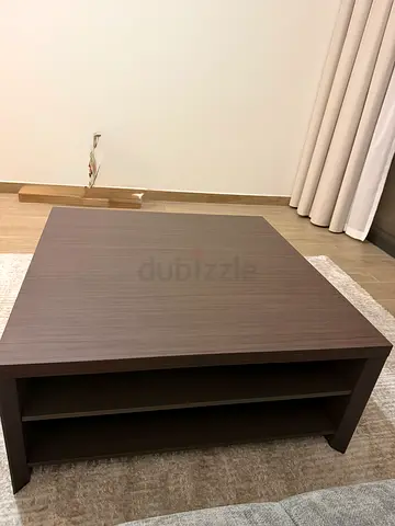 Square wooden coffee table with lower shelves - dark brown