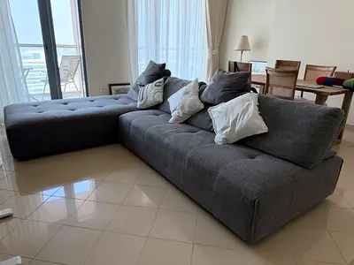 Large L-shaped Grey Fabric Sofa, 6 seater. The sofa has 2 separate parts, each has 210L, 100W, 44 H