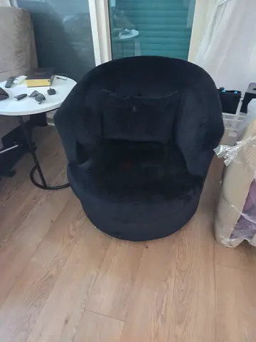 Comfortable black plush lounge chair - good condition. IIt swirls around.
