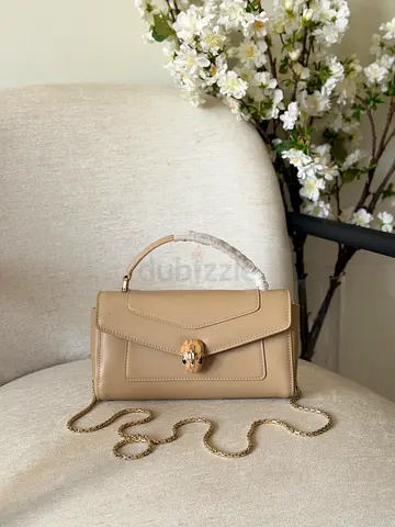 Beige structured top-handle shoulder bag with chain strap
