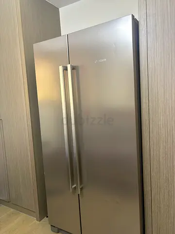 Spacious Bosch Side-by-Side Refrigerator - Good Condition