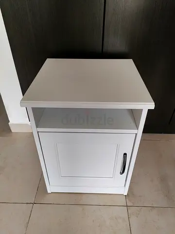 White bedside cabinet with storage shelf and door - good condition