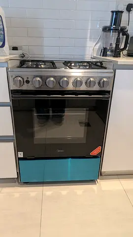 Midea 4-Burner Gas Cooker with Oven - new condition packed