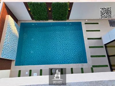 Includes registration and title transfer fees; two floors plus a roof terrace with a swimming pool; spacious layout.