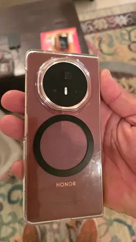 HONOR smartphone with clear protective case — good condition