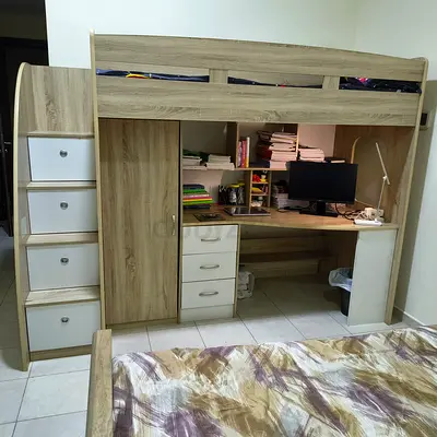 Bunk bed with chair and drawer on steps