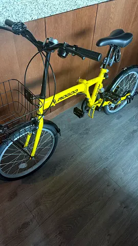 Yellow foldable city bike with front basket — good condition