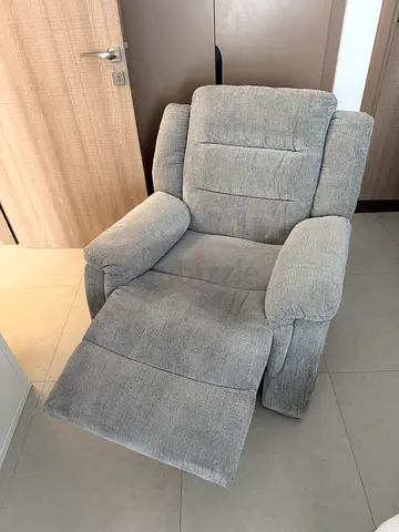 Light grey fabric recliner armchair in excellent condition!