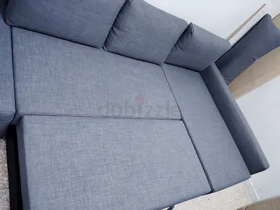 Light grey fabric L-shaped sofa bed - good condition
