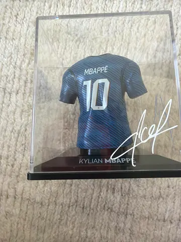 Kylian Mbappé mini figure with fake signature