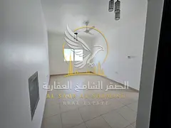 A one-bedroom apartment with a living room in Al-Qulai'a, featuring an open view, central air condit