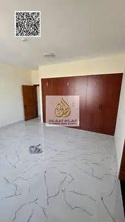 Two-bedroom apartment with a living room and a maid's room; annual rent; includes built-in wardrobes
