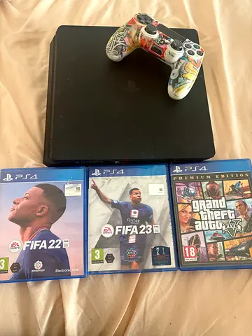 Sony PS4 Slim with DualShock controller + 3 PS4 games (FIFA 22, FIFA 23, GTA V)