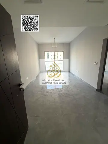 One-bedroom apartment with a living room for annual rent; first occupant (brand new); Al Rashidiya 3 area.