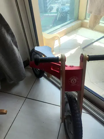 Wooden balance bike for toddlers - red