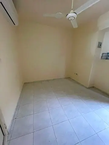 A spacious, separate kitchen studio apartment is available for annual rent in Sharjah at an attractive price, with flexible payment options and close