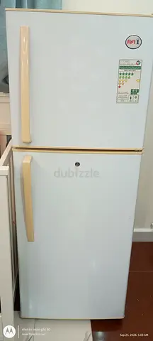 White double-door refrigerator (top freezer) - good working condition.