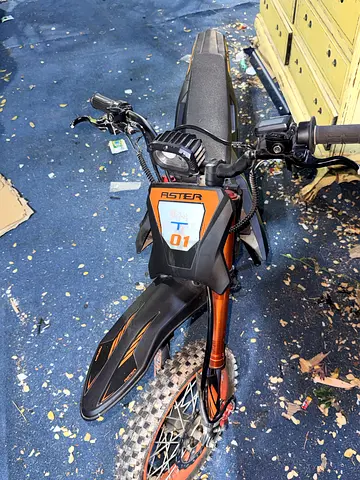 Used electric off-road bike (orange/black)