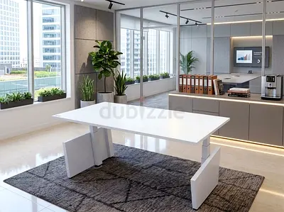 Herman Miller Modern white adjustable office desk on dark geometric rug