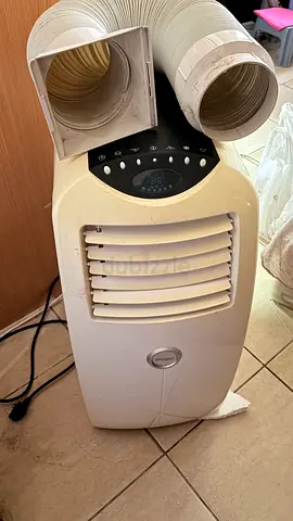 Portable air conditioner with exhaust ducts - used