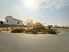 Corner land for sale in Al Houshi