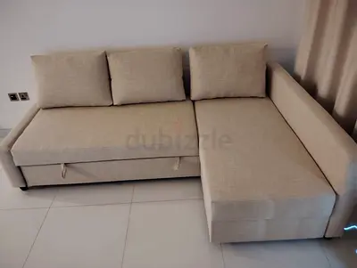 Beige L-shaped Sofa Bed with Storage — Good Condition