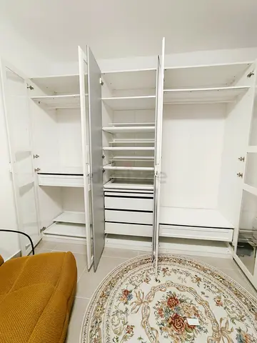 White built-in wardrobe / closet with drawers and shelving - good condition