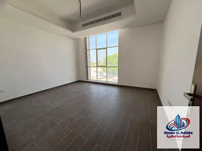 Brand new 2-story villa in Al Jazzat: 5 master BRs, spacious layout, maid's room, private 3-car parking. Prime location with easy Dubai access.