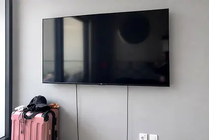 65-inch Flat Panel Smart TV - Wall Mounted, Good Condition