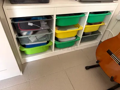 White storage cubby unit with colorful plastic bins – good condition
