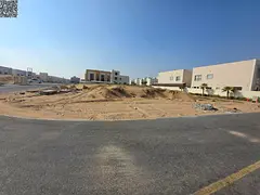 Two residential plots for sale on a street and alley behind services in a prime location in Al Zahiy