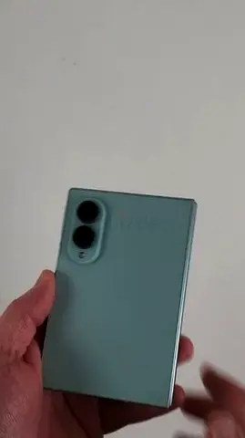 Mint green Samsung Galaxy Fold-style phone 256GB - light use, good condition with warranty and boxe