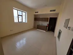 PRICE CRASH in Al Karamah! Studio with Central AC & Open Kitchen – AED 17,000 Yearly