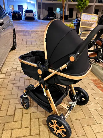Gold-frame black bassinet stroller - used, good condition