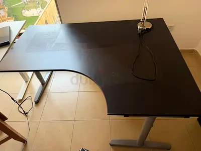 L-shaped corner desk, black + chrome desk lamp