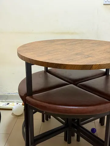 Round bar wooden dining table with 4 brown leather stools - compact set