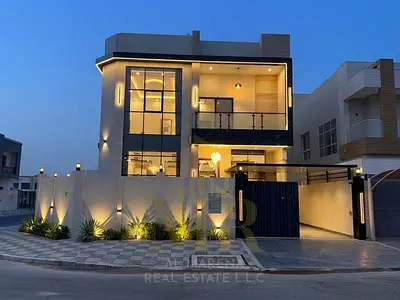 Luxury corner villa for sale in Al Yasmeen, Ajman – featuring 6 master bedrooms, a majlis, two living areas, and a rooftop terrace. Prime location; th