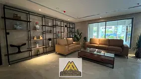 Brand-new 2BR in Al Nuaimiya, 2 baths, central AC, wardrobes, Kuwait St, AED 46,000 yearly.