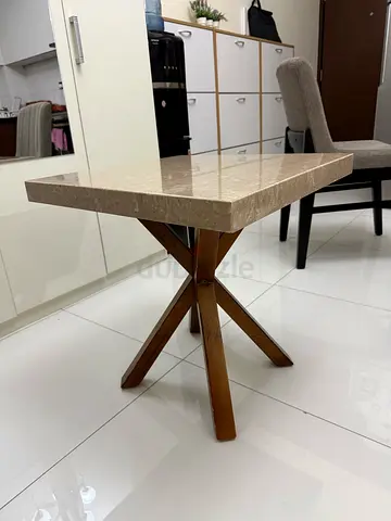Marble-top side table with wooden X-base, good condition
