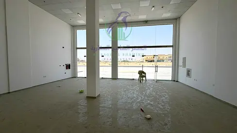 Brand-new 1,000 sq ft fitted shop for rent in Al Sajaah on a main road with glass facade. Ready for immediate use. Payable in 4 cheques.