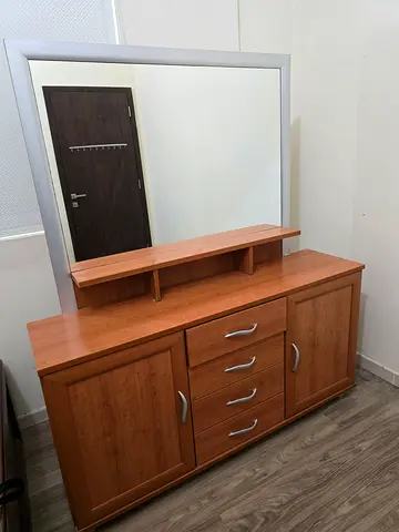 Wooden dresser with mirror and multiple drawers