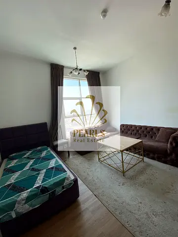A furnished one-bedroom apartment with a living room is available for annual rent in City Tower, Al Nuaimiya 3. It features free parking and two bathr