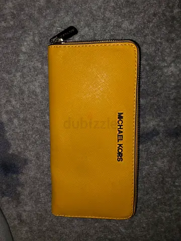 Michael Kors yellow zip-around wallet - good condition