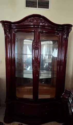 Antique-style wooden display cabinet with glass doors