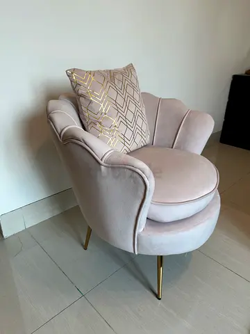 Light pink velvet accent chair with gold legs
