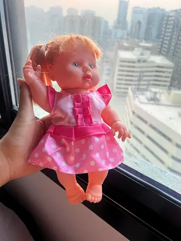 Small pink baby doll with dress - gently used