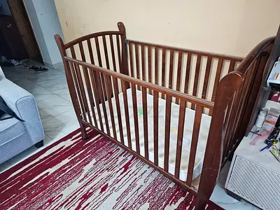 Solid wood baby crib with mattress - gently usedo