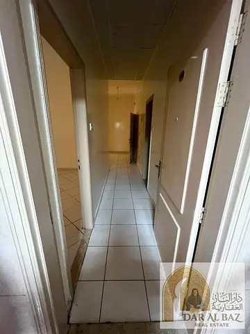 A 2-bedroom apartment with a living room is available for annual rent in the Al Majaz 3 area. The unit features two bedrooms, a living room, two bathr