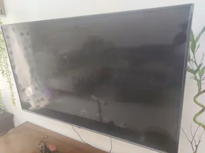 55-inch LED TV in good working condition - wall-mounted